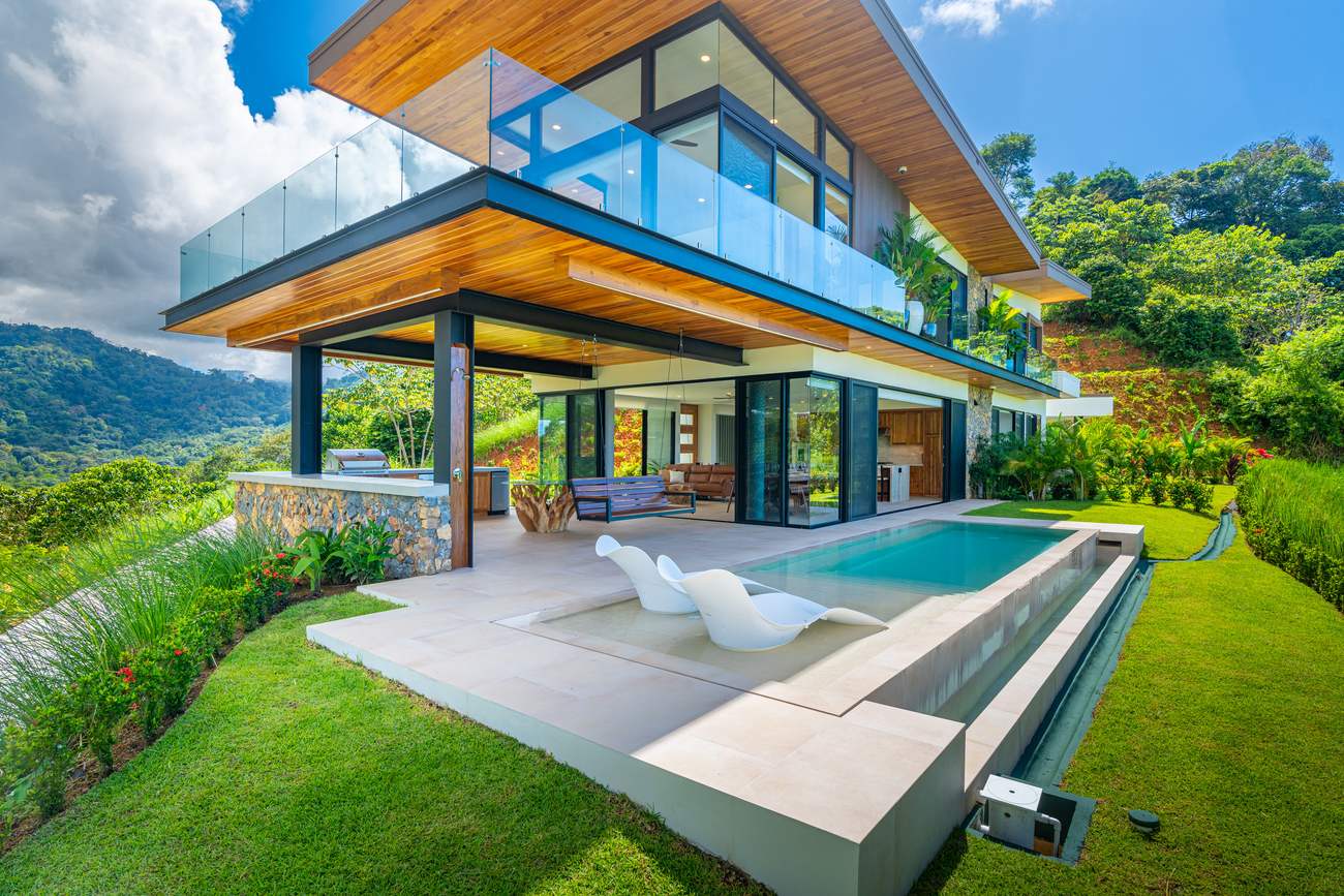 Modern Glass Estate &mdash; The covered terrace under the deep overhang