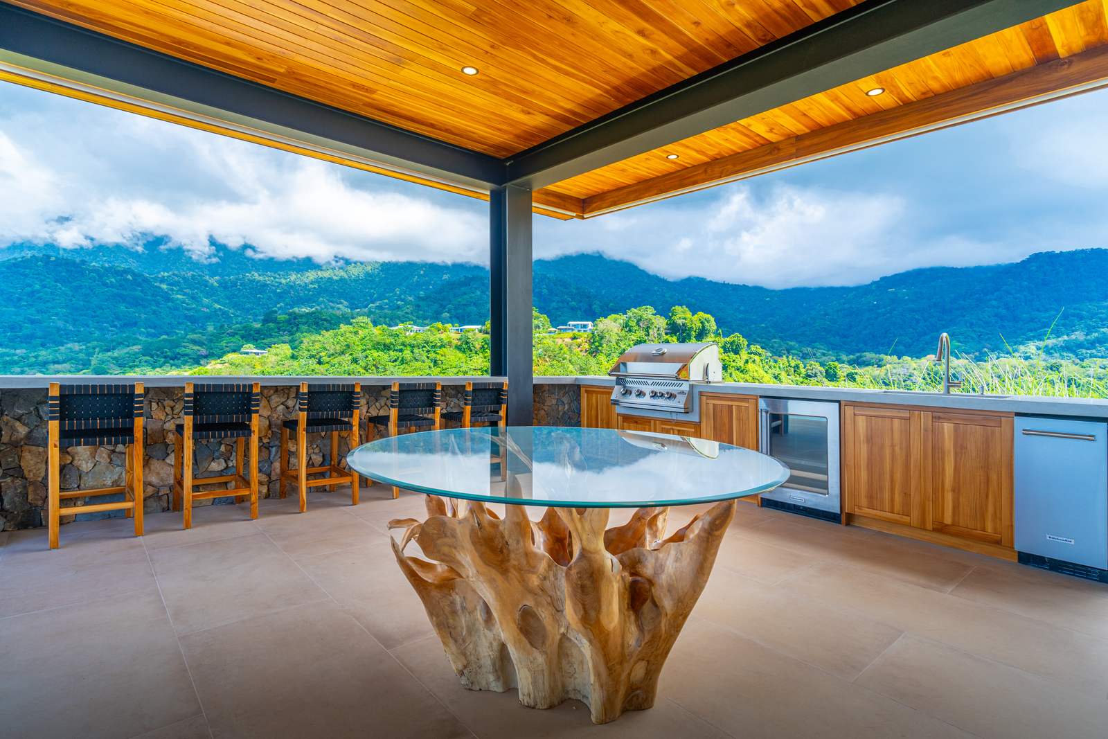 Modern Glass Estate &mdash; The great room, glass slid back into its recessed tracks