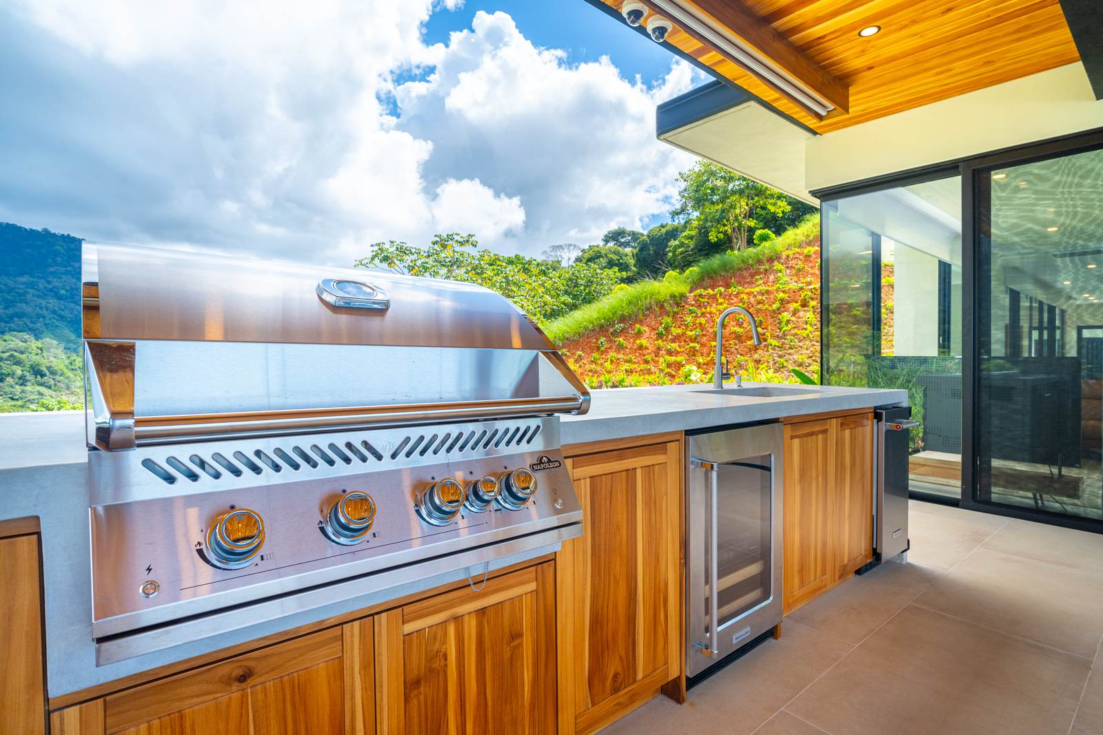Modern Glass Estate &mdash; The dining table under the teak ceiling
