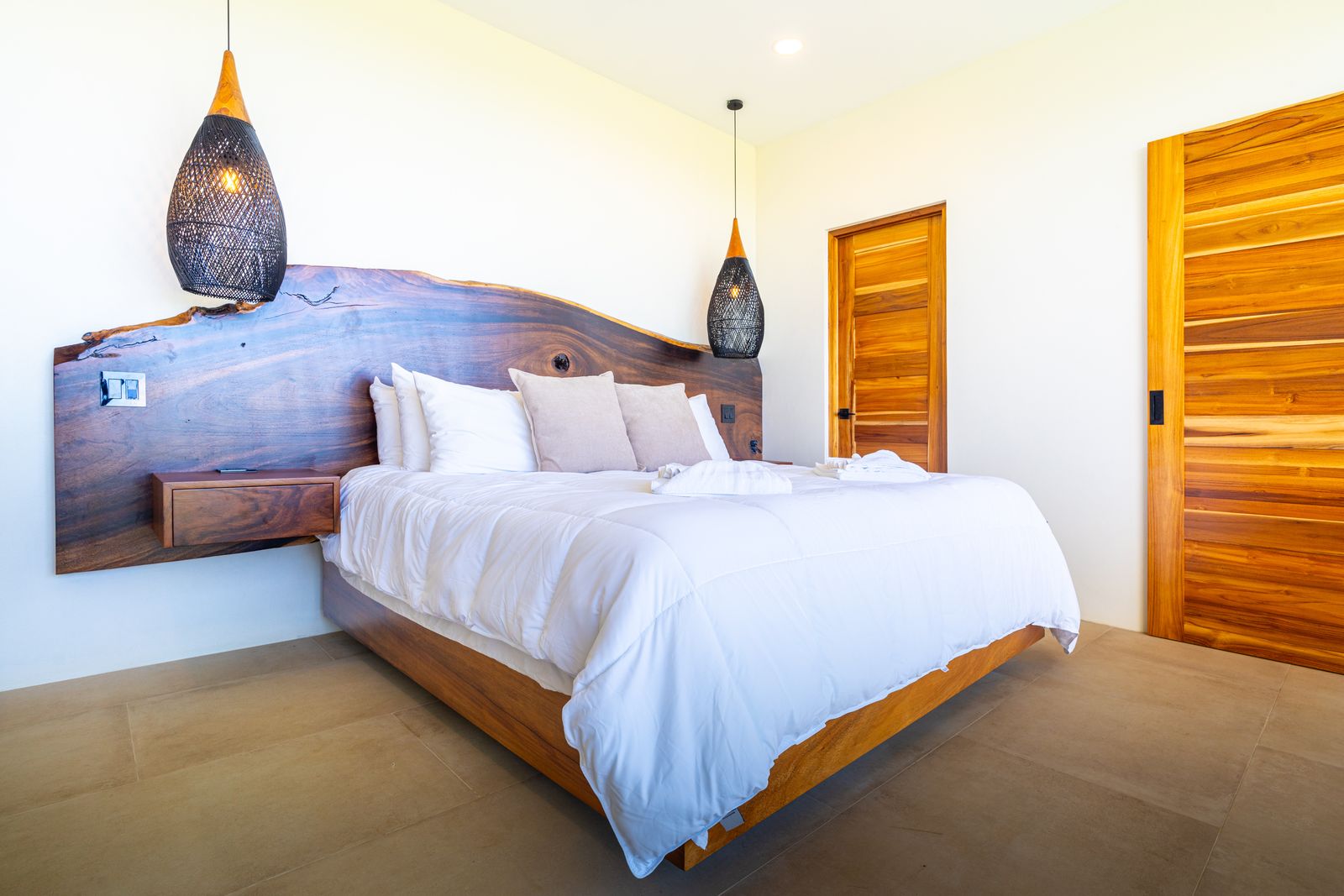 Modern Glass Estate &mdash; The primary suite, glazed to the mountains