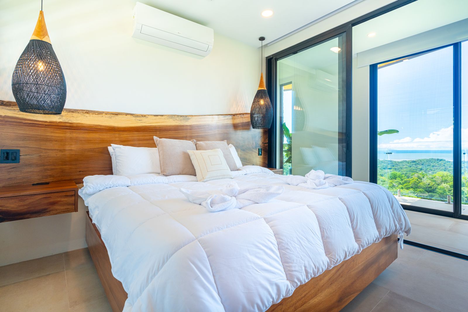 Modern Glass Estate &mdash; A bedroom lined in teak