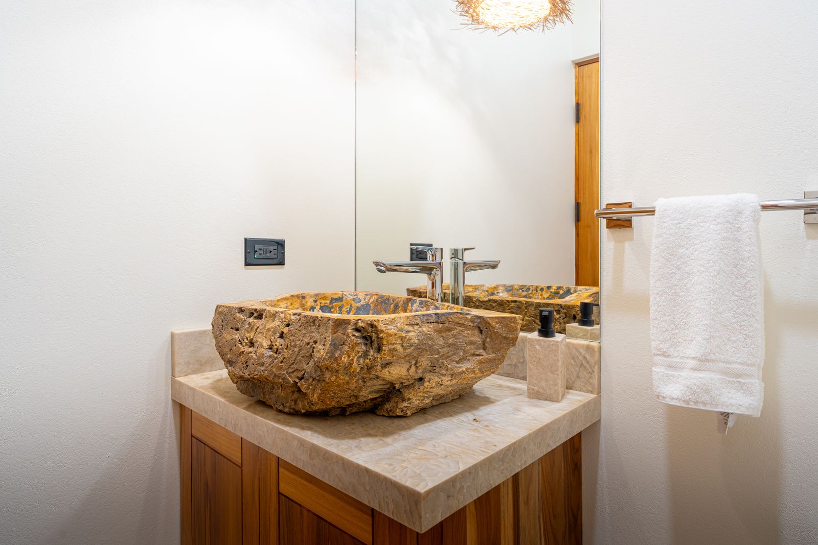 Modern Glass Estate &mdash; A carved stone tub