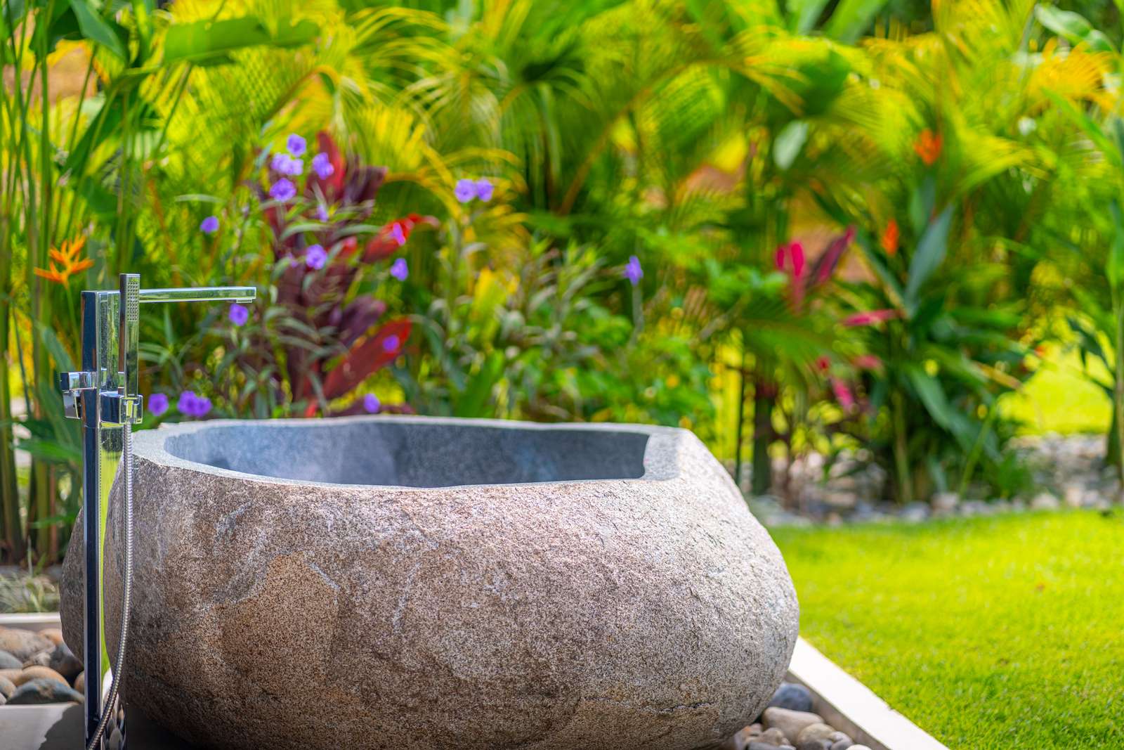 Modern Glass Estate &mdash; A stone tub set into the garden