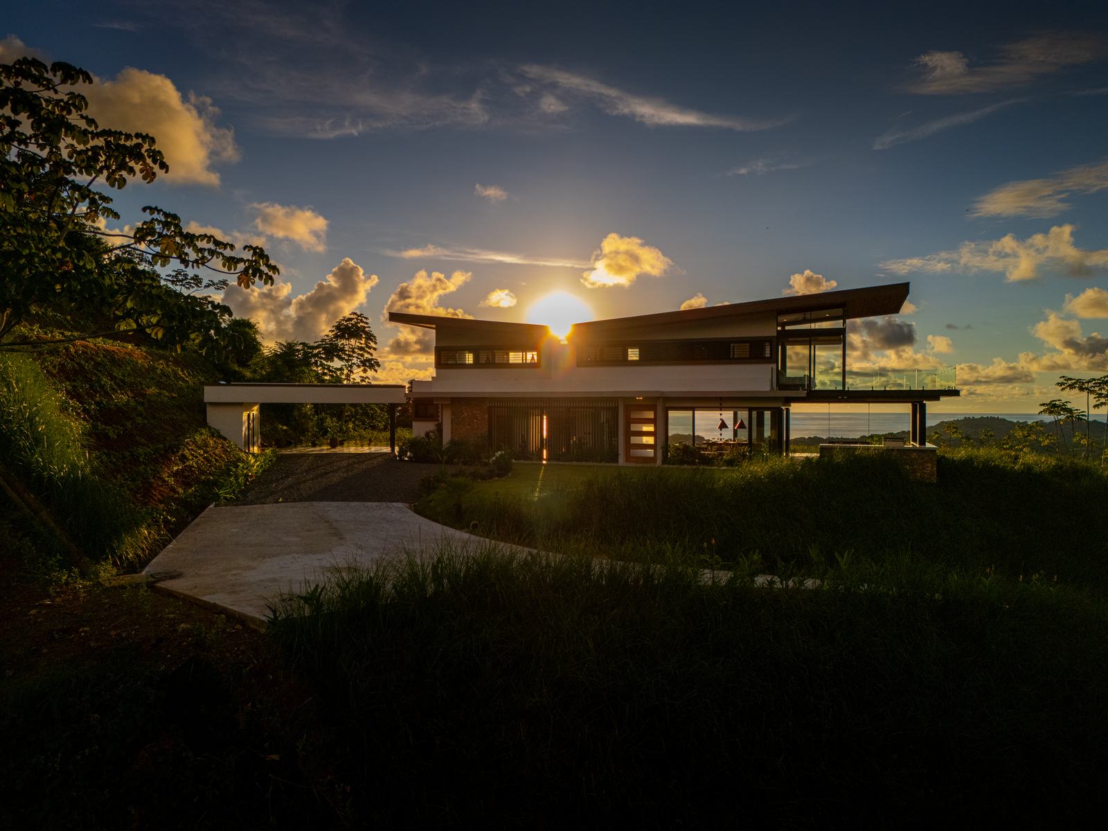 Modern Glass Estate &mdash; Sunset behind the house