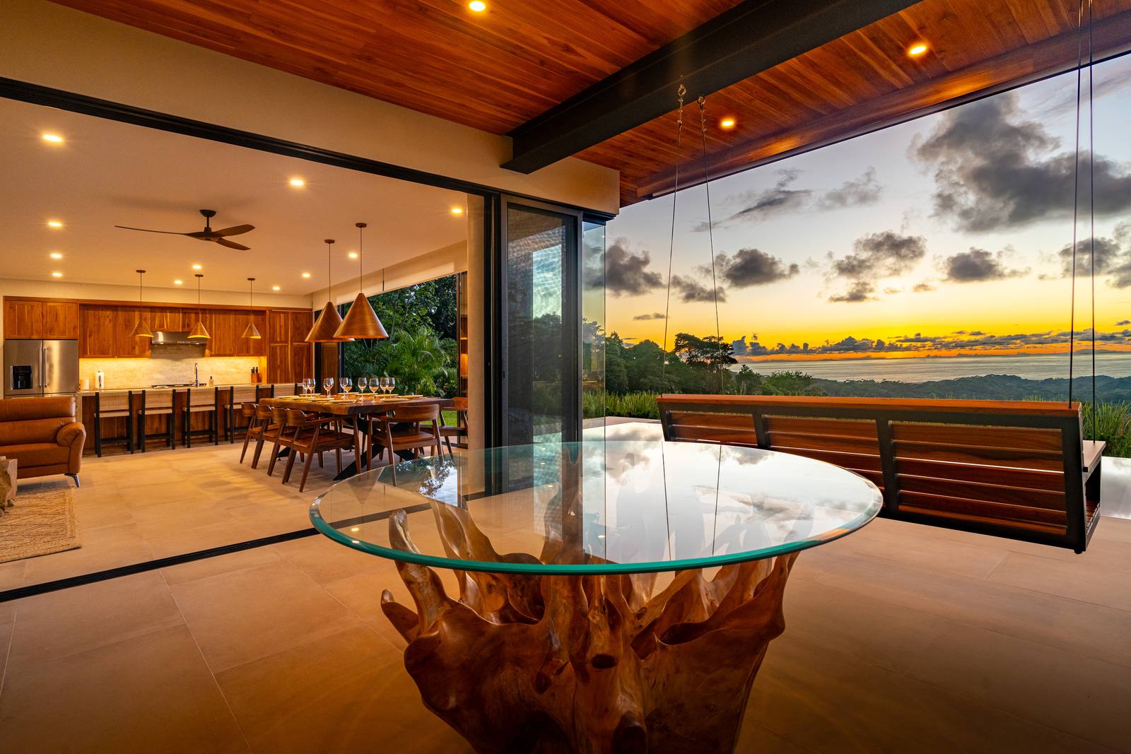 Modern Glass Estate &mdash; The terrace at dusk, lighting dimmed