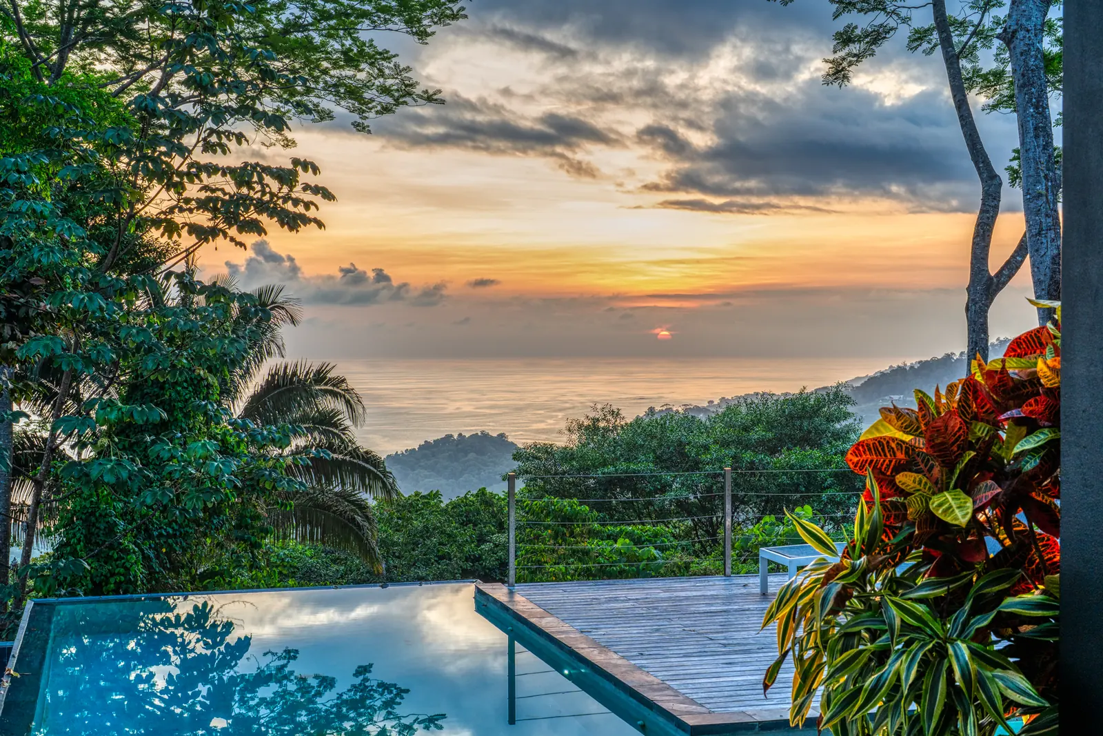 Villa Cosara — sunset over the pool and deck, above the canopy at Hermosa Retreat