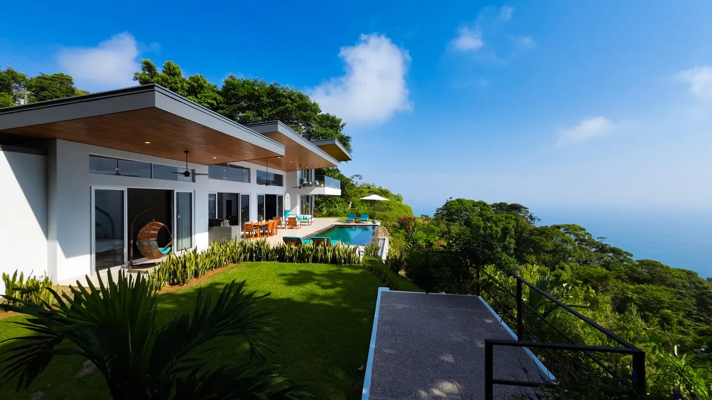 Villa Oro Verde &mdash; the lawn and the glass doors along the house