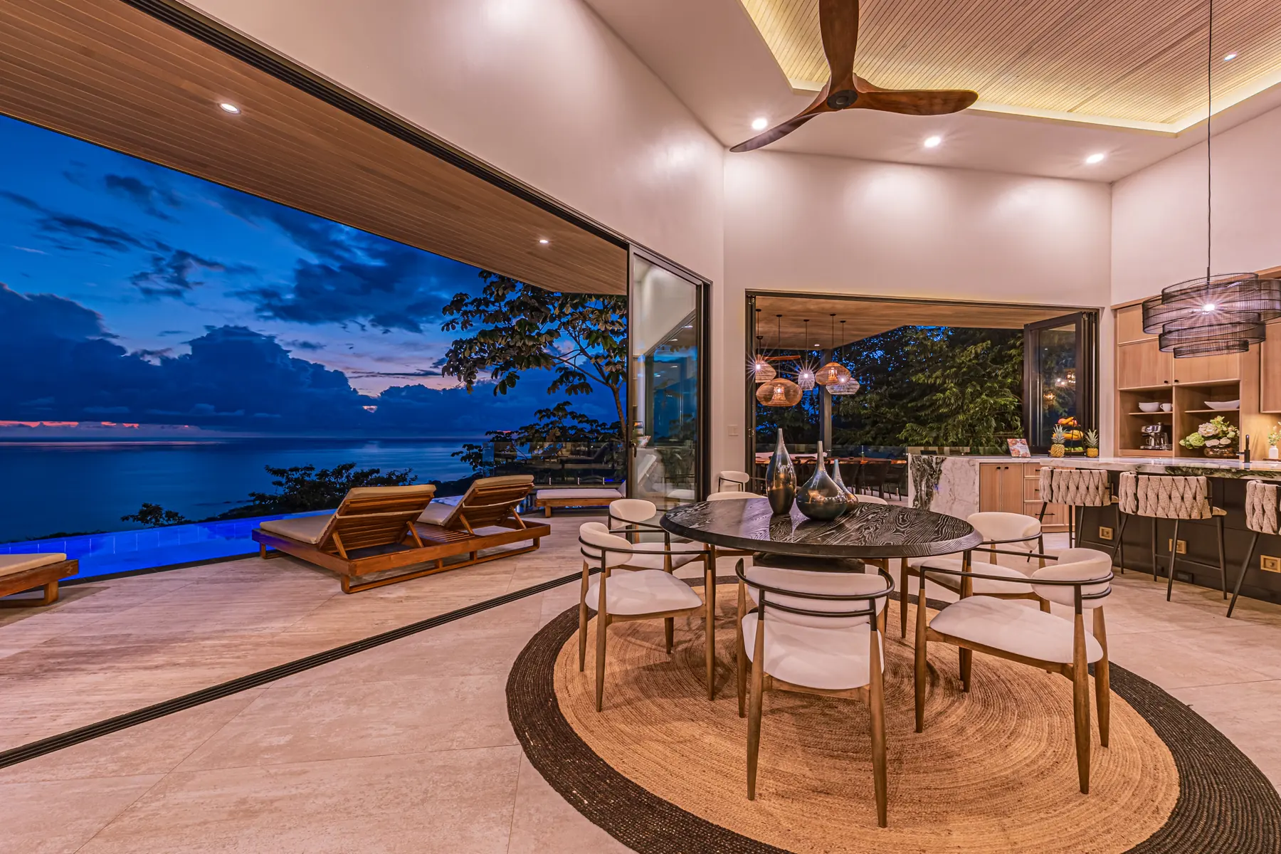 Villa San Martin &mdash; the great room open to the ocean at dusk