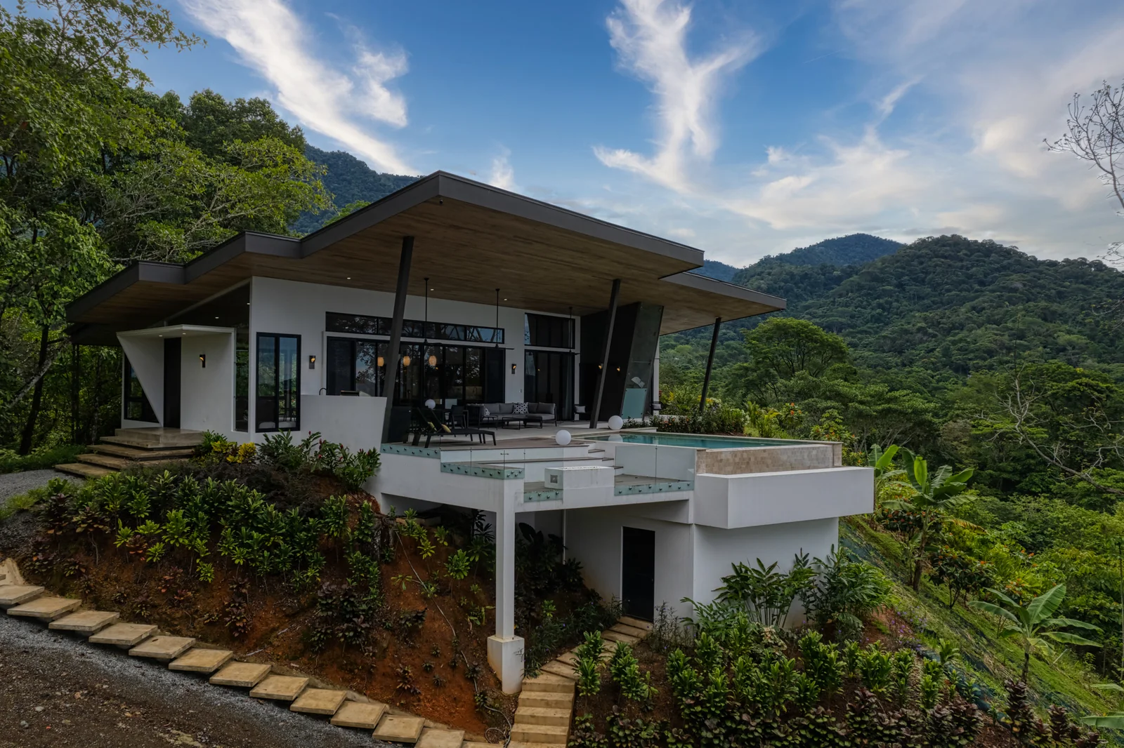 Vista Hermosa &mdash; the house from the garden, mature planting all round