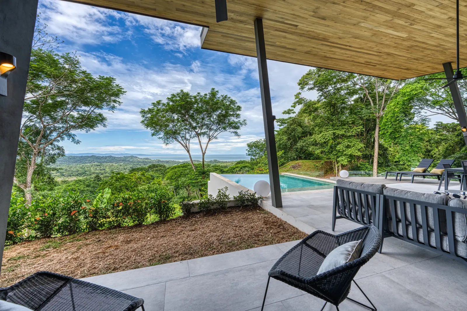 Vista Hermosa &mdash; the terrace under the deep eave, open to the mountains