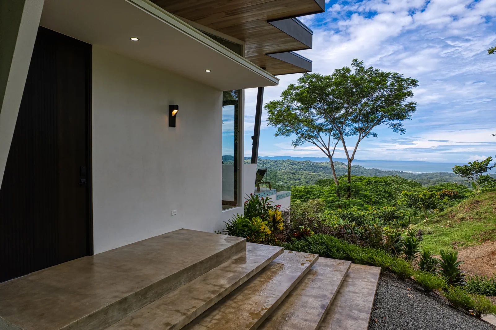 Vista Hermosa &mdash; the entry, in board-formed concrete and timber