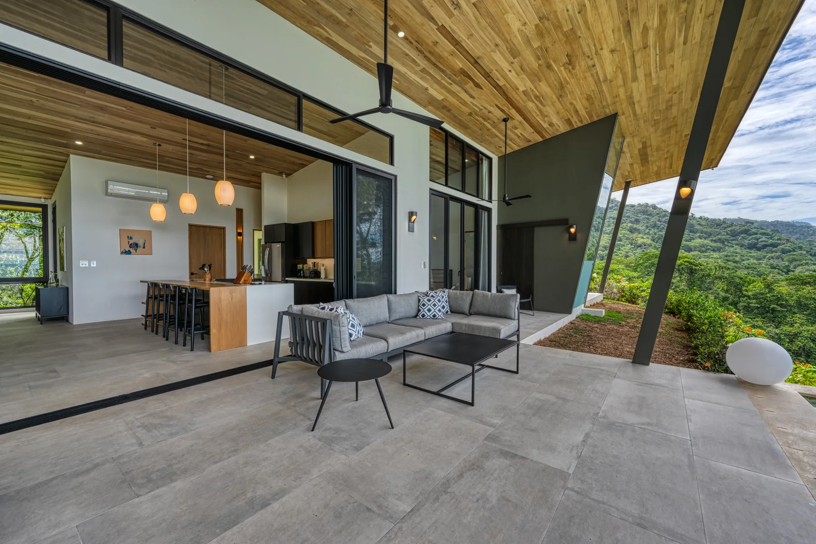 Vista Hermosa &mdash; living and kitchen opening straight onto the terrace