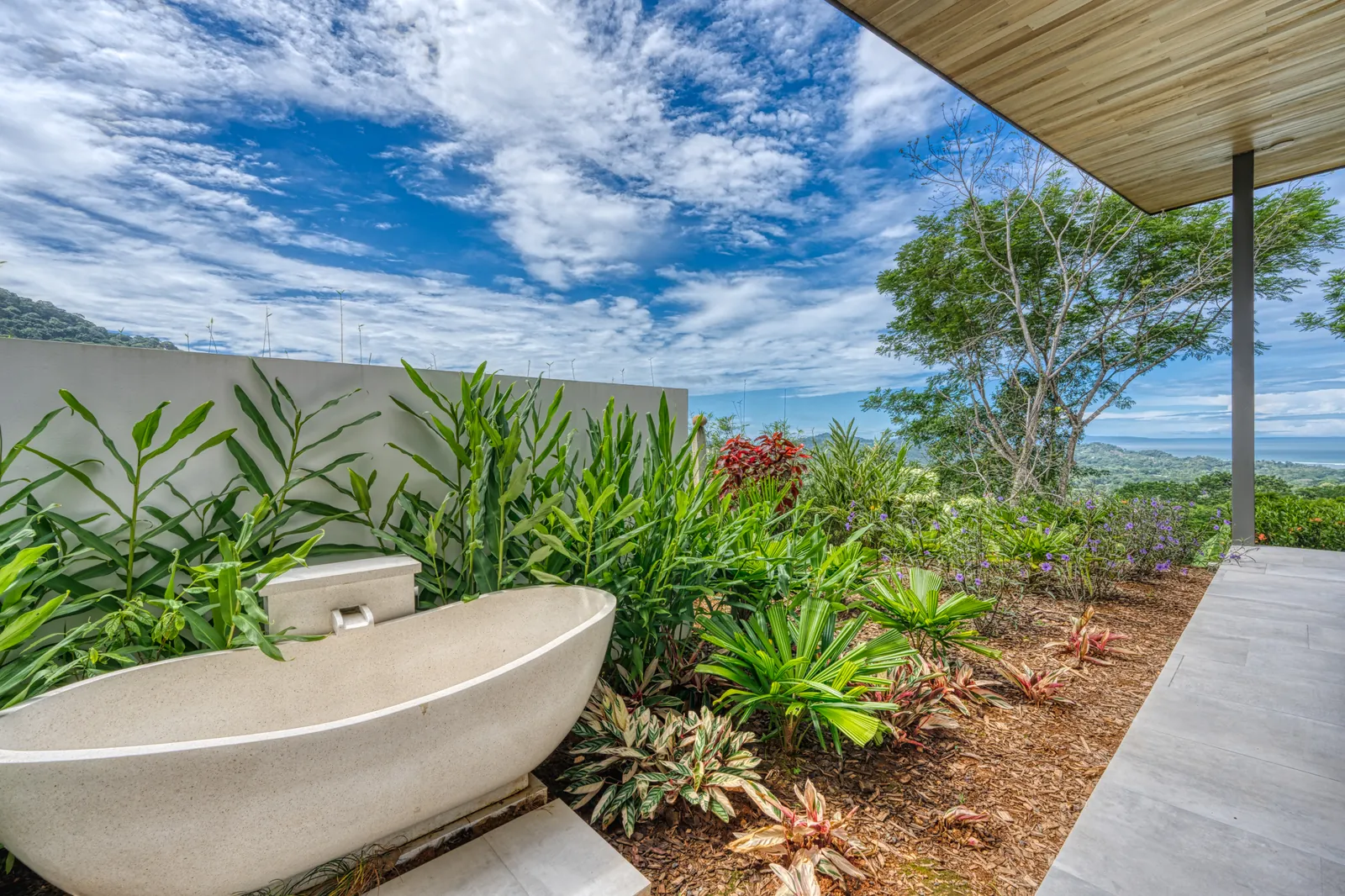 Vista Hermosa &mdash; the Bali-style outdoor tub, screened by planting