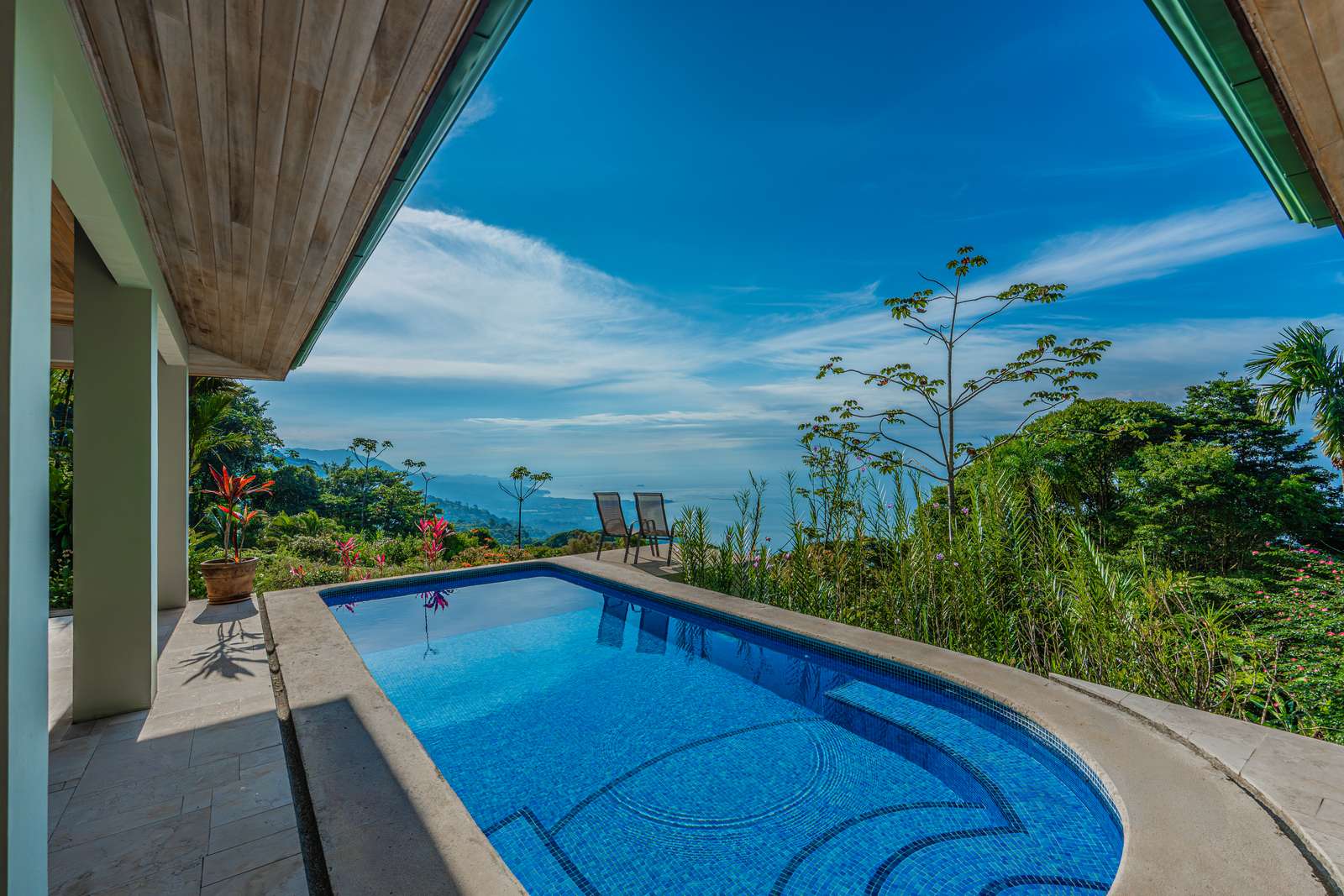 The pool and terrace, open to the Pacific