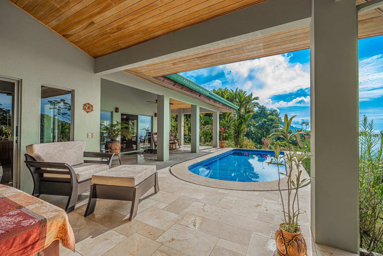 The living room opening directly onto the pool terrace