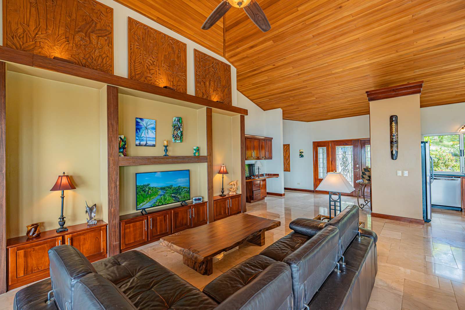 The living room and its expansive windows onto the Pacific