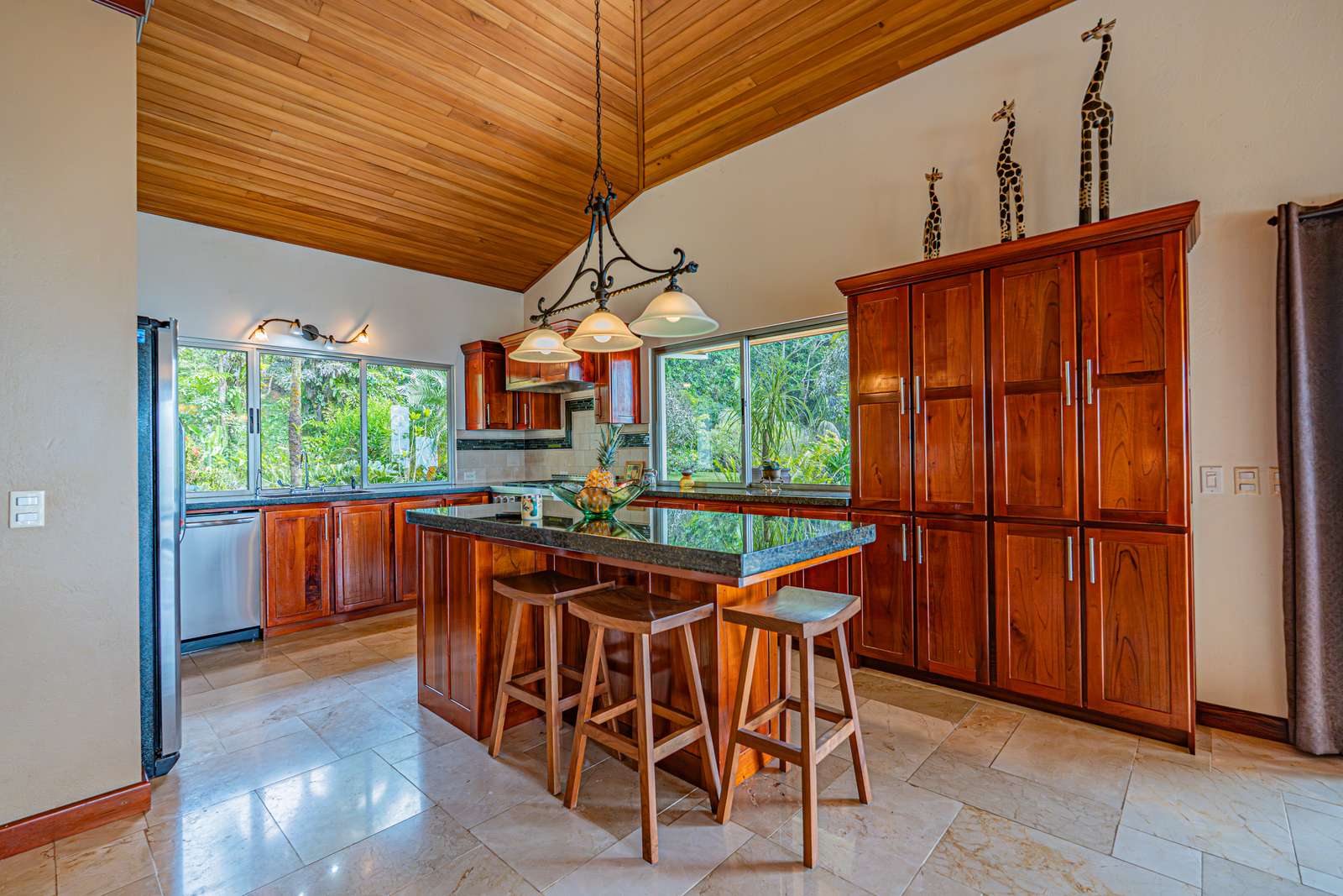 The kitchen, with granite counters and solid wood cabinetry